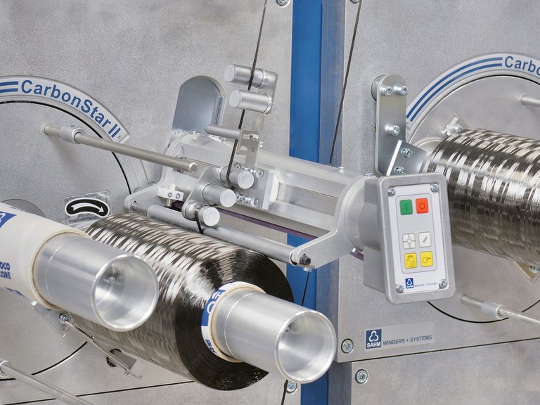 Textile winding machine with Franke linear guide